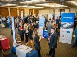 Students and employers talking to one another at a Career Fair in the Conference Center.